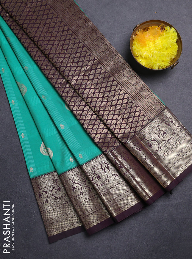 Semi kanchipuram silk saree teal green and wine shade with allover self emboss checks & zari buttas and rich zari woven border