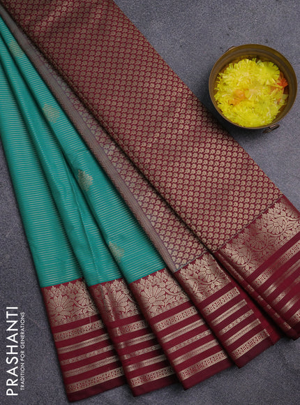 Semi kanchipuram silk saree teal green and wine shade with allover zari weaves & buttas and rettapet zari woven korvai border