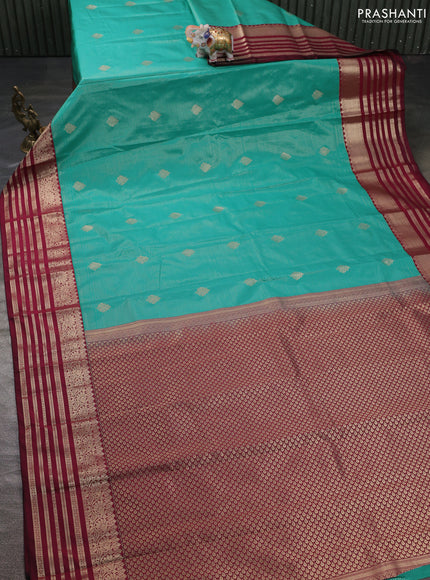 Semi kanchipuram silk saree teal green and wine shade with allover zari weaves & buttas and rettapet zari woven korvai border
