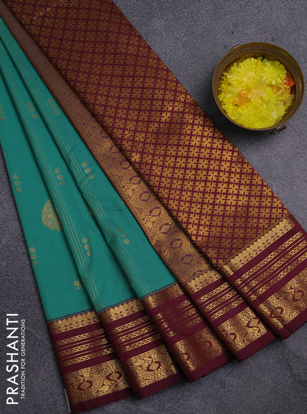 Semi kanchipuram silk saree teal green shade and wine shade with allover zari weaves & buttas and zari woven border