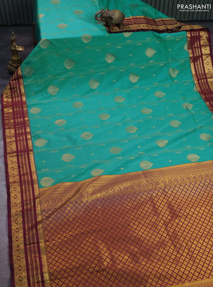 Semi kanchipuram silk saree teal green shade and wine shade with allover zari weaves & buttas and zari woven border
