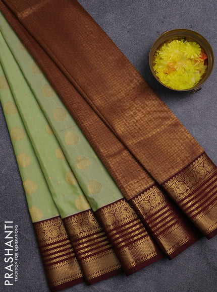 Semi kanchipuram silk saree pista green and maroon with allover zari woven buttas and zari woven korvai border