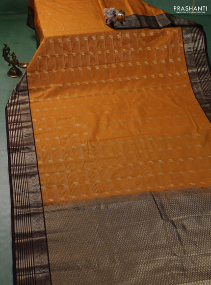 Semi kanchipuram silk saree mango yellow and coffee brown with allover zari weaves & buttas and zari woven korvai border