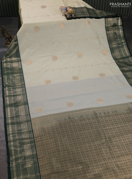 Semi kanchipuram silk saree cream and bottle green with zari woven buttas and long zari woven border
