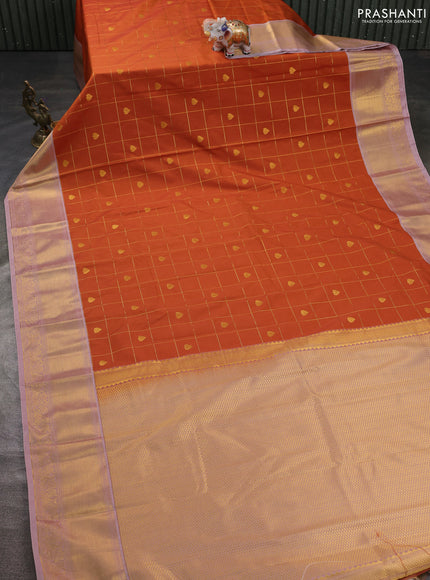 Semi kanchipuram silk saree dark mustard and pastel pink with allover zari checks & buttas and zari woven korvai border