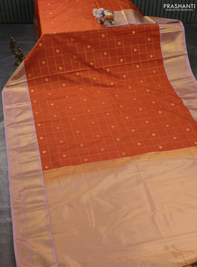 Semi kanchipuram silk saree dark mustard and pastel pink with allover zari checks & buttas and zari woven korvai border