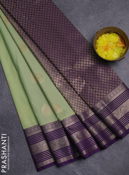 Semi kanchipuram silk saree pista green and violet with zari woven buttas and zari woven korvai border
