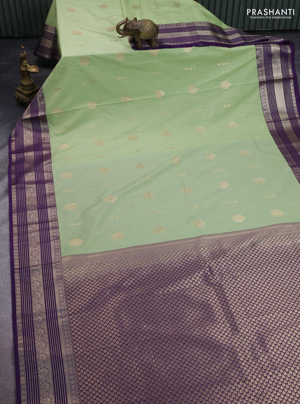 Semi kanchipuram silk saree pista green and violet with zari woven buttas and zari woven korvai border