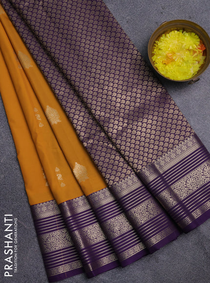 Semi kanchipuram silk saree mustard yellow and violet with zari woven buttas and zari woven korvai border