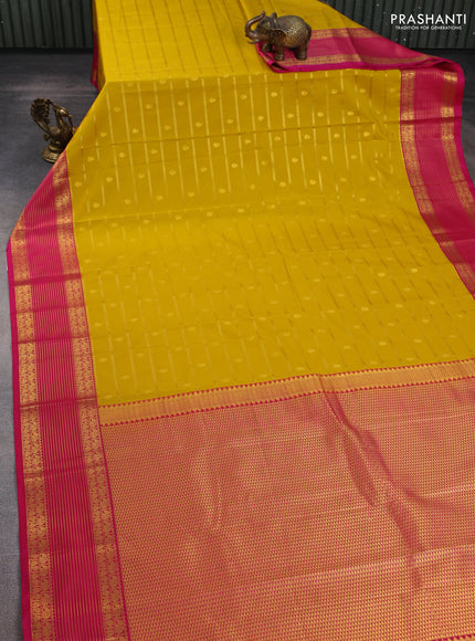 Semi kanchipuram silk saree mustard yellow and pink with allover zari weaves & buttas and zari woven korvai border
