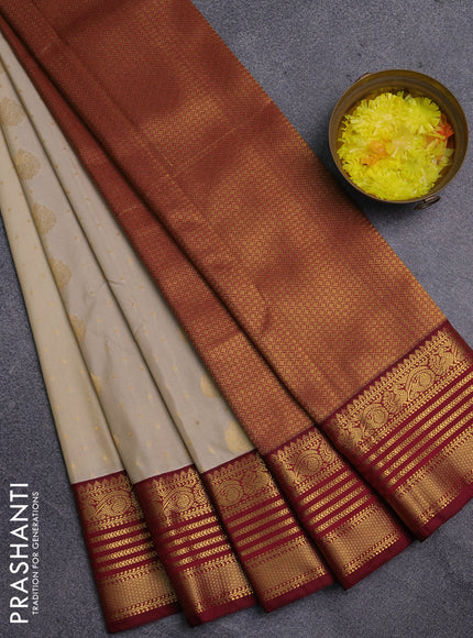 Semi kanchipuram silk saree cream and maroon with allover zari woven buttas and zari woven korvai border