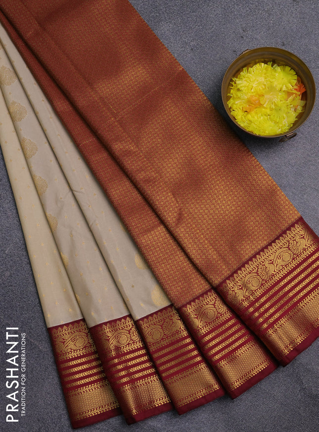 Semi kanchipuram silk saree cream and maroon with allover zari woven buttas and zari woven korvai border
