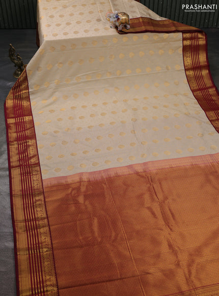 Semi kanchipuram silk saree cream and maroon with allover zari woven buttas and zari woven korvai border
