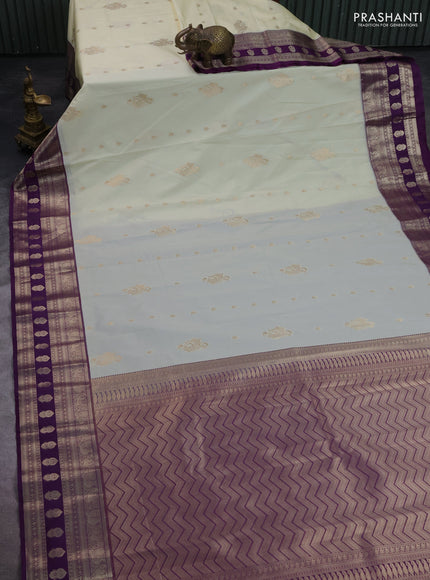 Semi kanchipuram silk saree cream and purple with zari woven buttas and zari woven korvai border