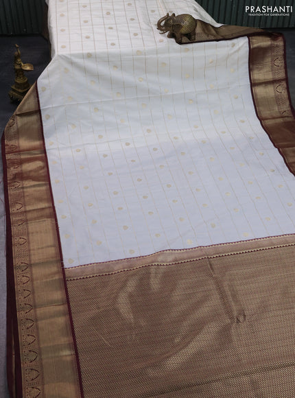 Semi kanchipuram silk saree off white and deep maroon with allover zari checks & buttas and zari woven korvai border