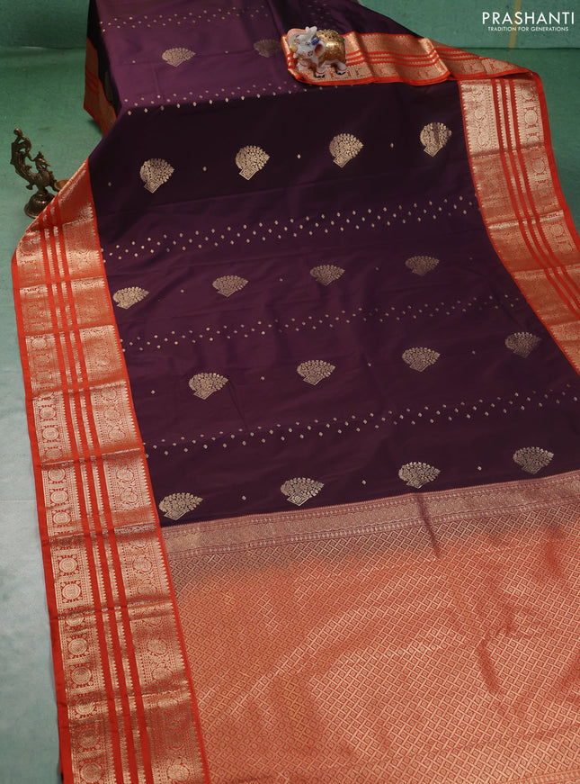 Semi kanchipuram silk saree wine shade and orange with allover zari wwoven buttas and long zari woven korvai border