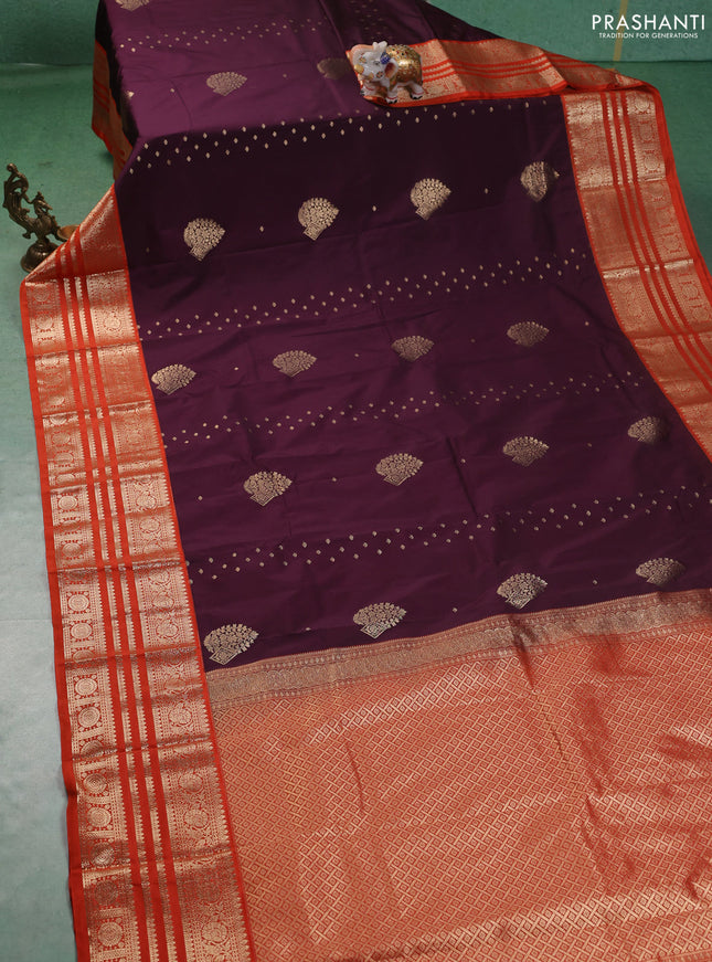 Semi kanchipuram silk saree wine shade and orange with allover zari wwoven buttas and long zari woven korvai border