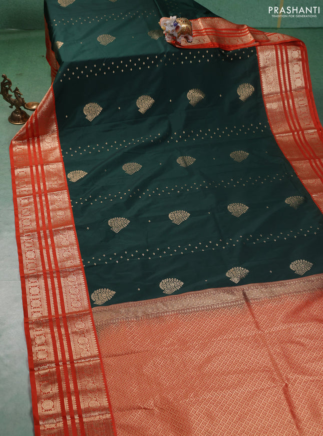 Semi kanchipuram silk saree bottle green and orange with allover zari wwoven buttas and long zari woven korvai border