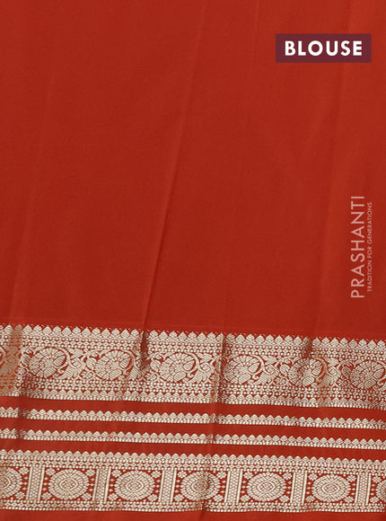 Semi kanchipuram silk saree wine shade and orange with allover zari wwoven buttas and long zari woven korvai border