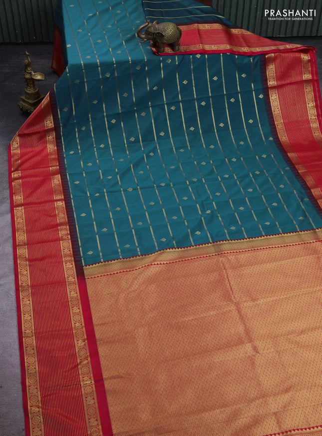 Semi kanchipuram silk saree peacock blue and pink with allover zari weaves & buttas and temple design zari woven korvai border