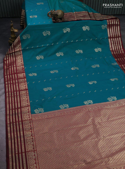 Semi kanchipuram silk saree dual shade of teal blue and wine shade with zari woven buttas and long zari woven korvai border