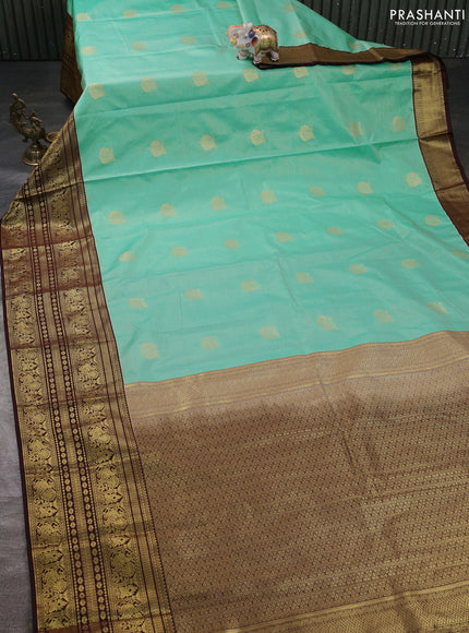 Semi kanchipuram silk saree teal blue and coffee brown with allover zari weaves & buttas and long zari woven korvai border