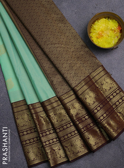 Semi kanchipuram silk saree teal green shade and coffee brown with allover zari weaves & buttas and long zari woven korvai border