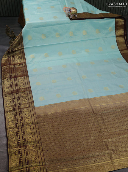 Semi kanchipuram silk saree pastel blue and coffee brown with allover zari weaves & buttas and long zari woven korvai border