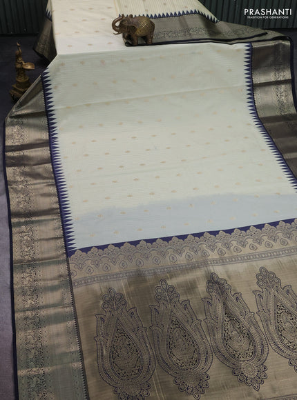 Semi kanchipuram silk saree cream and navy blue with allover small zari checks & buttas and long zari woven border