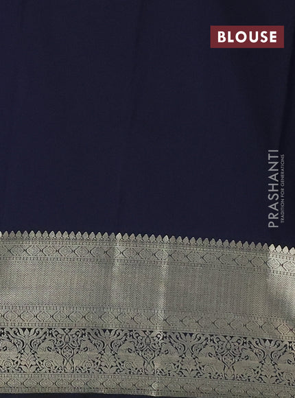 Semi kanchipuram silk saree dual shade of pinkish orange and navy blue with allover small zari checks & buttas and long zari woven border