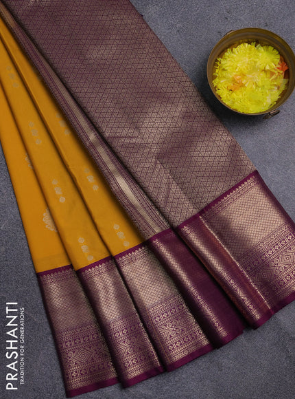 Semi kanchipuram silk saree mustard yellow and purple with allover zari woven buttas and long zari woven korvai border