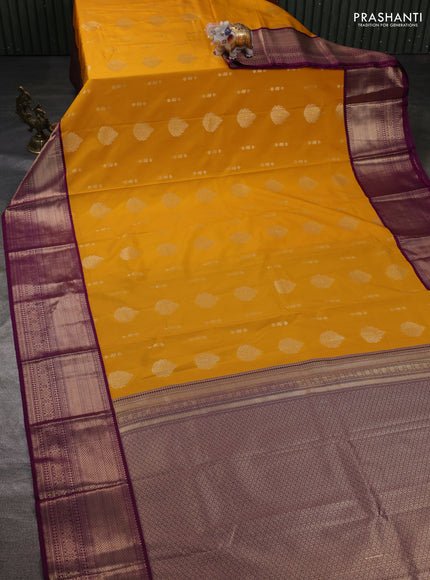 Semi kanchipuram silk saree mustard yellow and purple with allover zari woven buttas and long zari woven korvai border