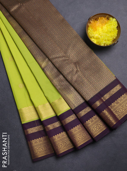Semi kanchipuram silk saree fluorescent green and purple with zari woven buttas and long zari woven korvai border