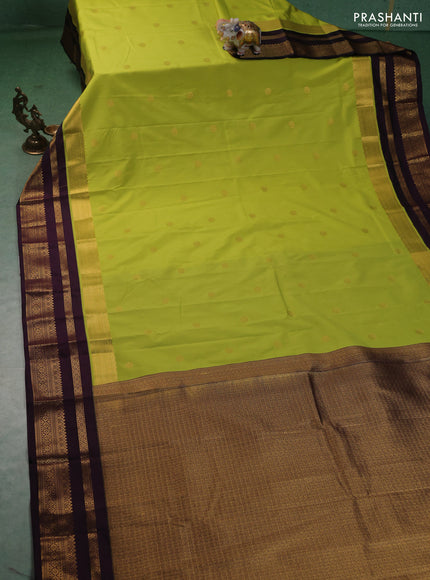 Semi kanchipuram silk saree fluorescent green and purple with zari woven buttas and long zari woven korvai border