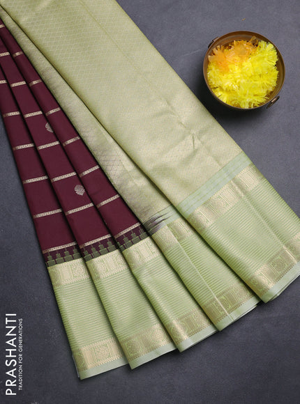 Semi kanchipuram silk saree deep maroon and mild pista green with allover zari weaves & buttas and long temple design zari woven korvai border