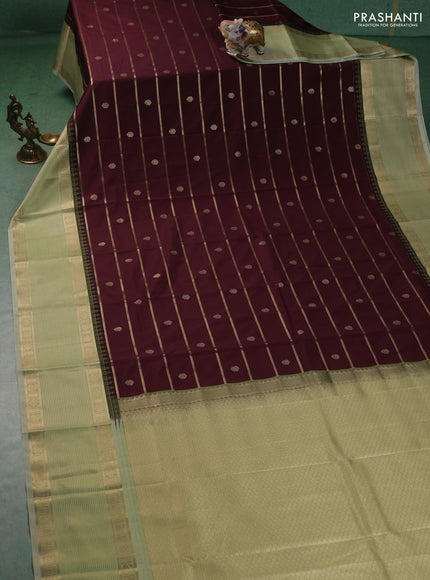 Semi kanchipuram silk saree deep maroon and mild pista green with allover zari weaves & buttas and long temple design zari woven korvai border