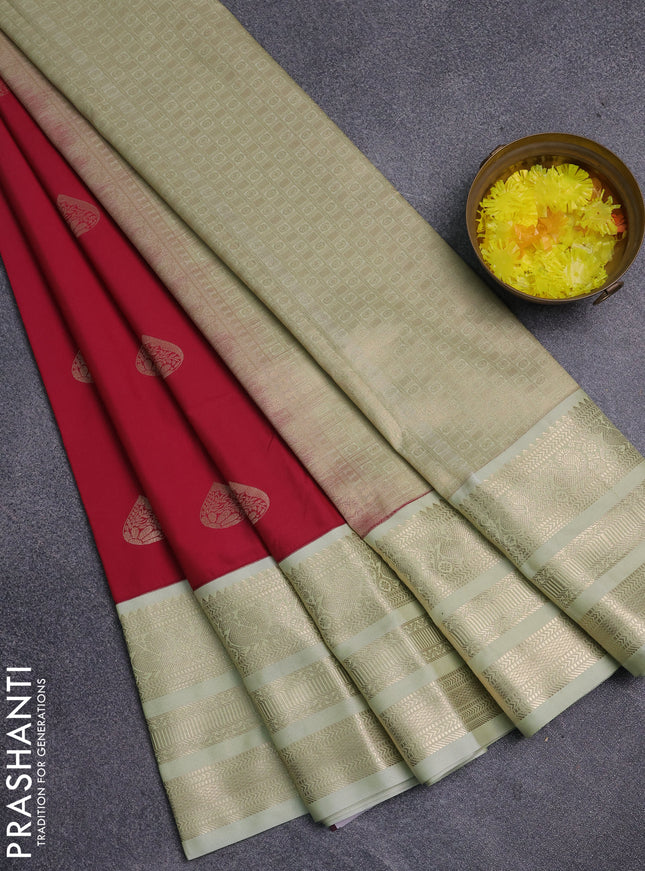 Semi kanchipuram silk saree tomato pink and pista green with zari woven buttas and long zari woven korvai border