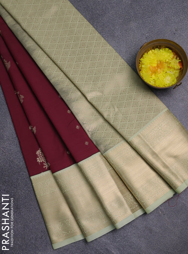 Semi kanchipuram silk saree wine shade and mild pista green with zari woven buttas and long zari woven korvai border