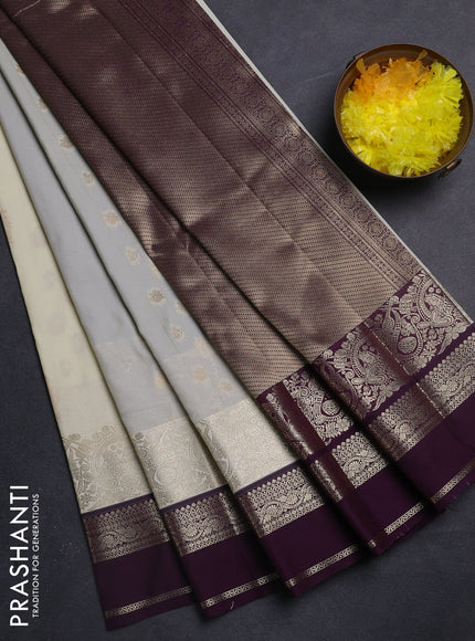 Semi kanchipuram silk saree cream and purple with zari woven buttas and long zari woven border