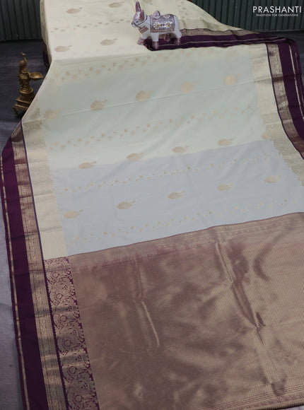 Semi kanchipuram silk saree cream and purple with zari woven buttas and long zari woven border