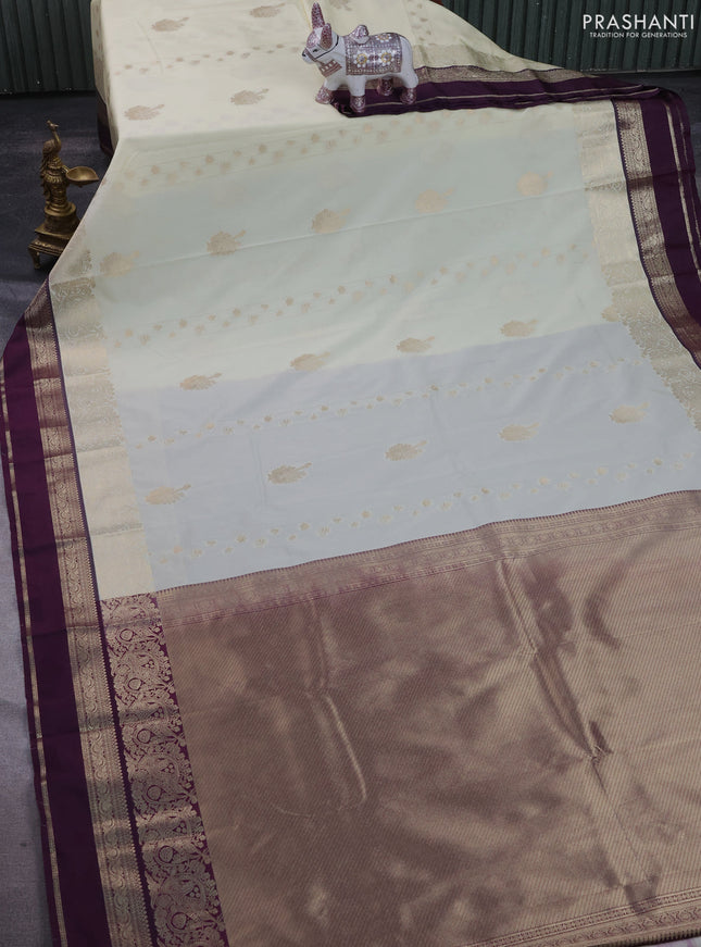 Semi kanchipuram silk saree cream and purple with zari woven buttas and long zari woven border