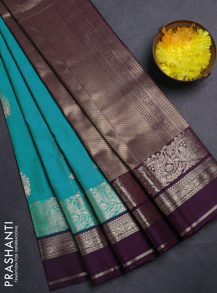 Semi kanchipuram silk saree blue shade and purple with zari woven buttas and long zari woven border