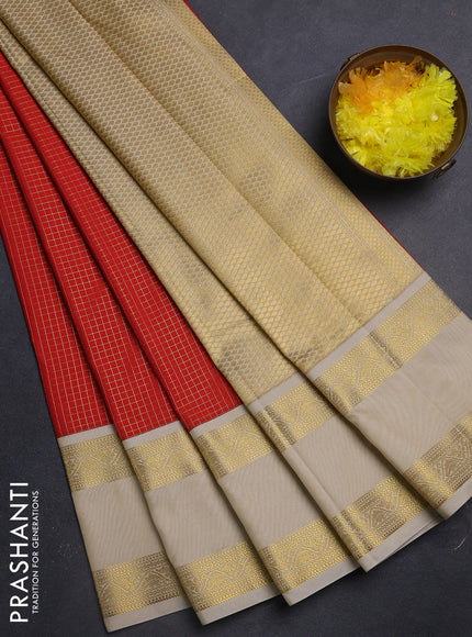 Semi kanchipuram silk saree orange and beige with allover small zari checks & buttas and rettapet zari woven korvai border
