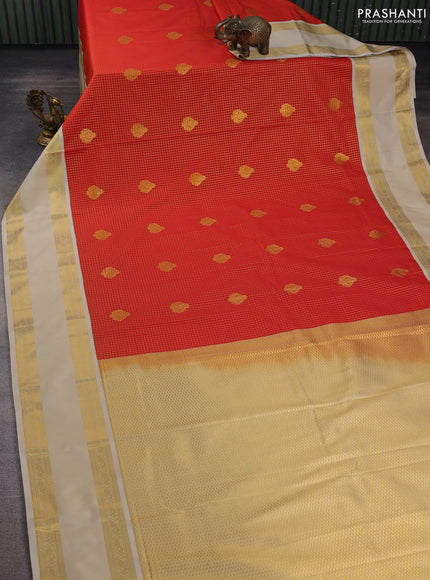 Semi kanchipuram silk saree orange and beige with allover small zari checks & buttas and rettapet zari woven korvai border