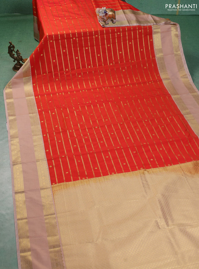 Semi kanchipuram silk saree orange and sandal with allover zari stripe weaves & buttas and rettapet zari woven korvai border