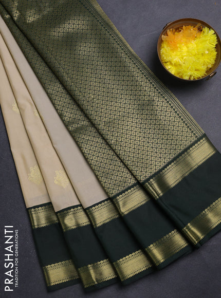 Semi kanchipuram silk saree beige and bottle green with zari woven buttas and rettapet zari woven korvai border