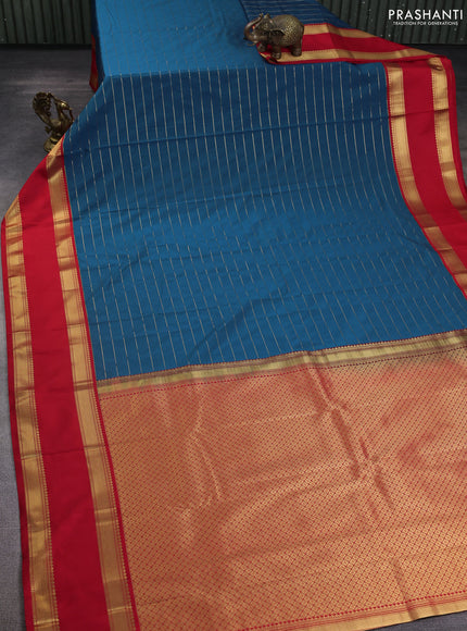 Semi kanchipuram silk saree peacock blue and red with allover zari stripe weaves and rettapet zari woven korvai border