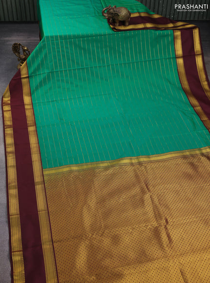 Semi kanchipuram silk saree green and coffee brown with allover zari stripe weaves and rettapet zari woven border
