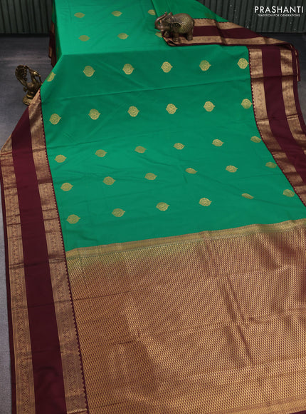 Semi kanchipuram silk saree green and deep maroon with zari woven buttas and rettapet zari woven korvai border