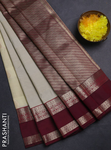 Semi kanchipuram silk saree cream and wine shade with allover zari weaves & buttas and rettapet zari woven korvai border